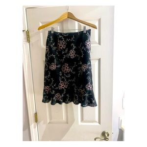 Grace Elements used embroidered ladies’ skirt with ruffle hem. Knee length.